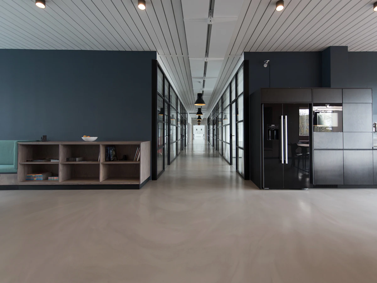 A bright office with desks and chairs.