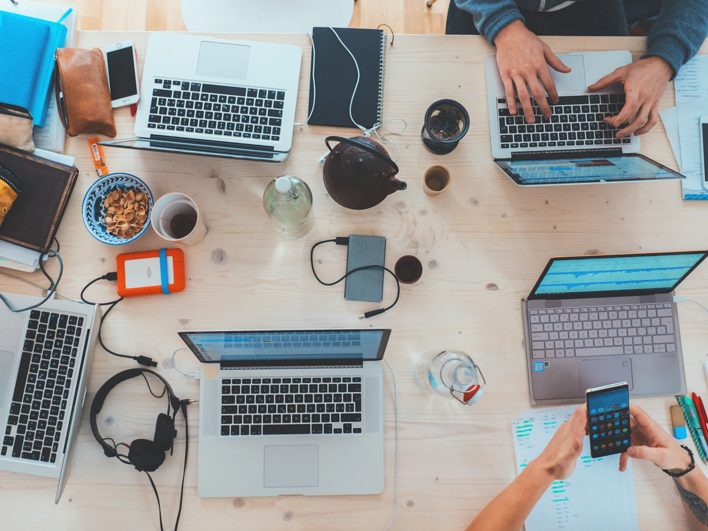 People working together around laptops.